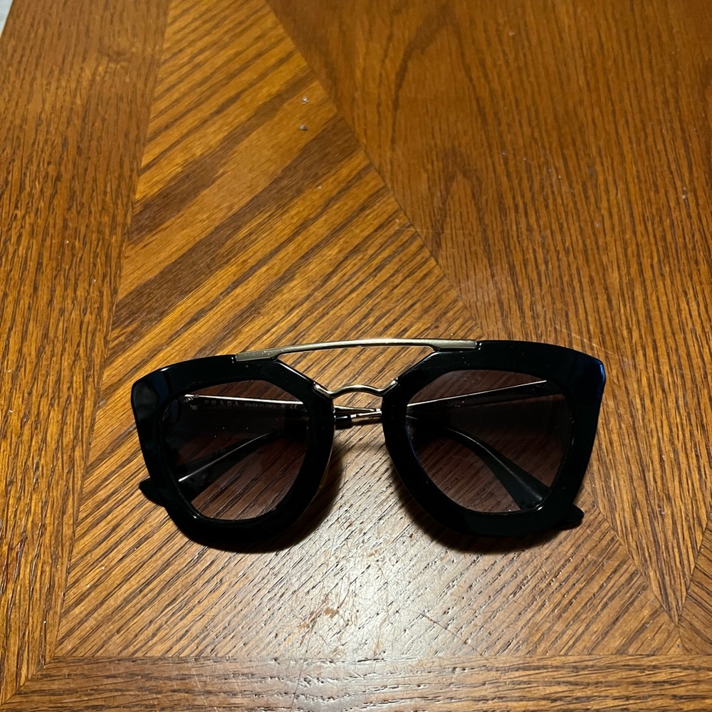 Prada Black Cat-Eye Sunglasses with Gold Accents